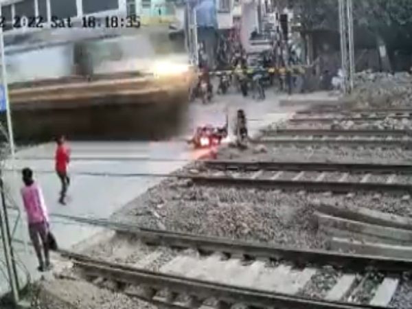 Accident Video Biker Has Close Shave With Train Watch Shocking Viral Video