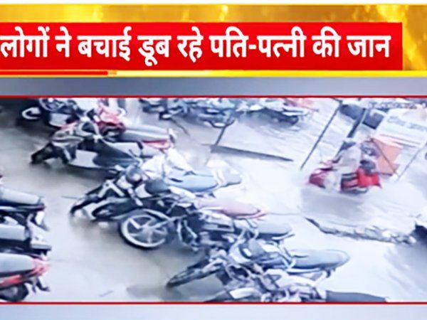 Aligarh scooty riding couple fell in a road pit 
