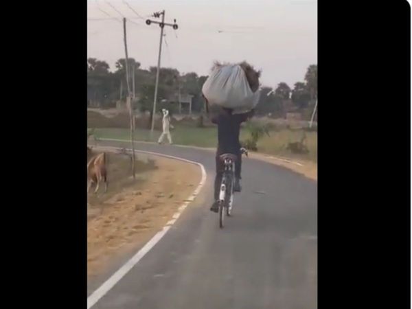 Man Cycling With Balancing sack Anand Mahindra Share Video Goes Viral