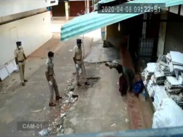 Homeless person maintain social distancing during receiving food from Police