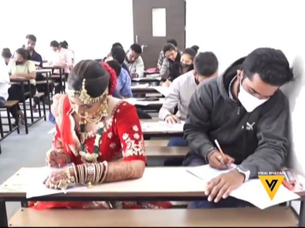 Viral Video: शादी के जोड़े में परीक्षा देने पहुंची दुल्हन, वीडियो वायरल होने पर ये सच्चाई आई सामने