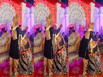Groom going to put a garland on bride neck, suddenly the bride sit on the ground, Watch video Groom going to put a garland on bride neck, suddenly the bride sit on the ground, Watch video