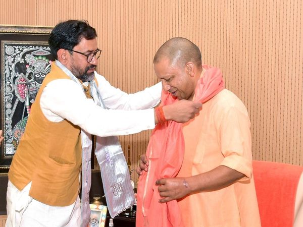 CM Yogi Adityanath and Dinesh Lal Yadav Nirahua