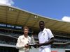 Joe root Jason holder with wisden Trophy
