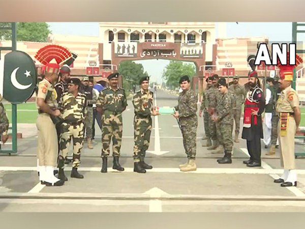 BSF and Pak Rangers presents sweets to each other at Wagah-Attari border on Eid Al-Adha