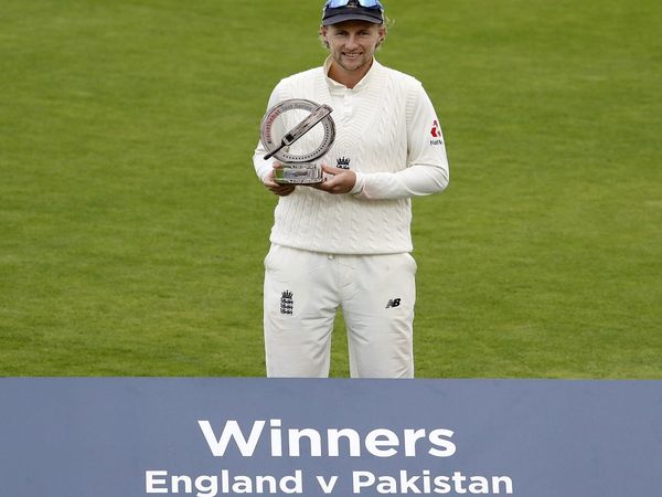 Joe Root with winners trophy