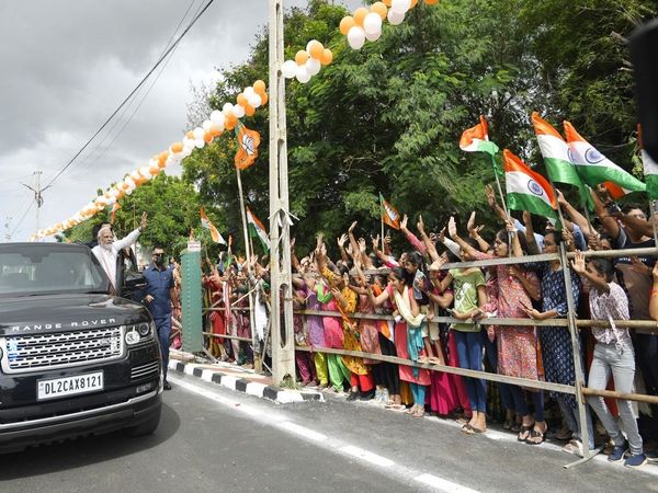 PM Narendra Modi receives a warm welcome from the people of Bhuj Gujarat during Road Show