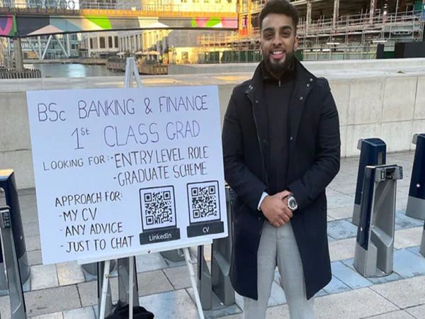 Haider Malik stood outside a tube station with his CVs