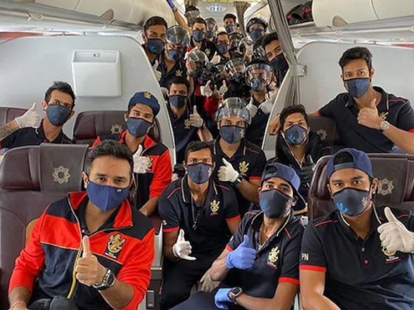 RCB players in mask