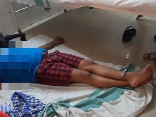 journalist chained to a hospital bed