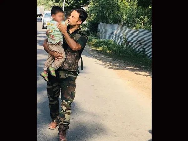 Jammu Kashmir sopore 3 year old kid taken to safety by police after his father was killed by terrorist