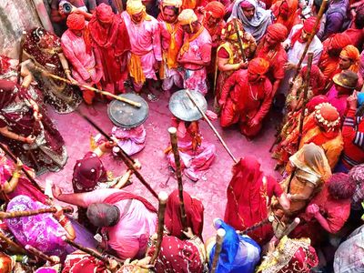 Lathmar Holi played in Mathura's Barsana lots of lathi sticks devotees immersed in bliss Lathmar Holi played in Mathura's Barsana lots of lathi sticks devotees immersed in bliss