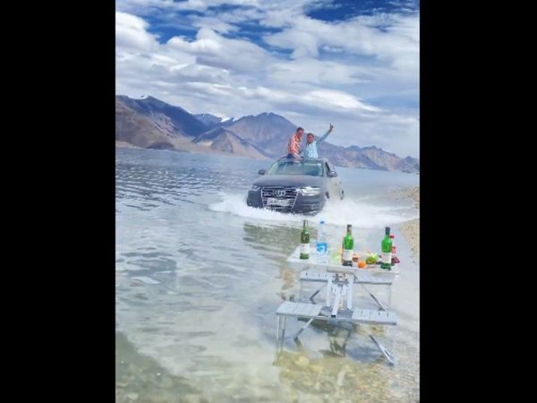 tourists drive Audi car in Ladakh lake Video Goes Viral People Shocked