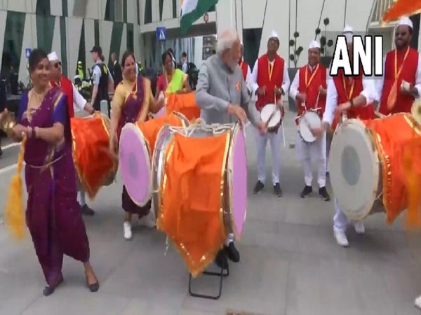 Denmark PM Modi tries his hand on a drum and meets members of the Indian community later