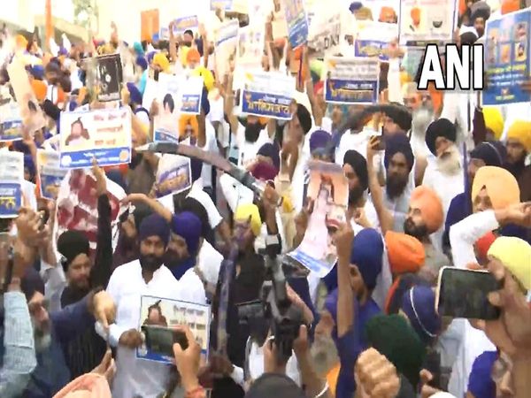 A group of people gathers at the entrance to the Golden Temple in Amritsar raises pro Khalistan slogans