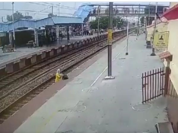 Lady crossing Railway track Then What Happened Watch Viral Video