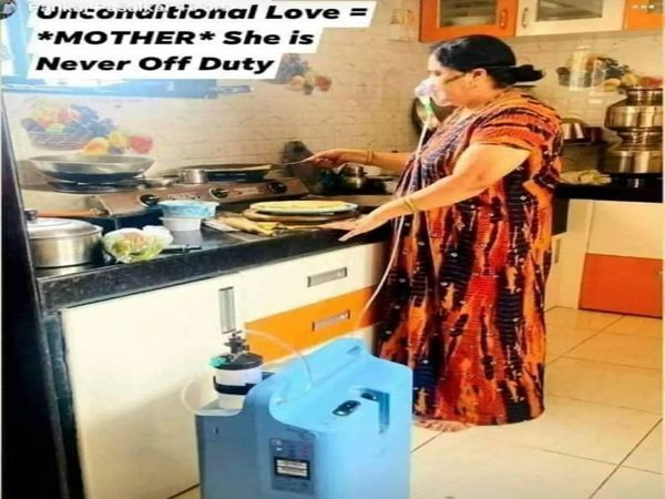 Viral Photo a woman seen making food for her family while she is on oxygen 