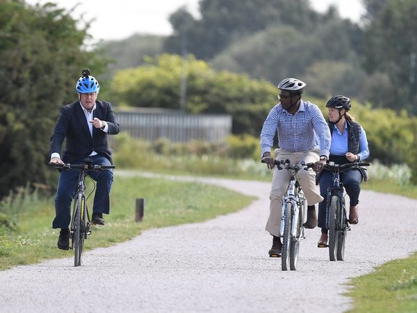 British PM Boris Johnson arrives to launch health program by riding a Made in India Hero cycle