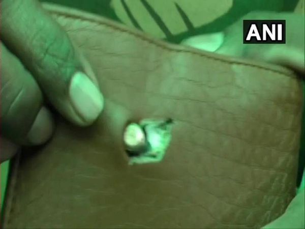 The bullet got stuck in his wallet inside his bullet jacket