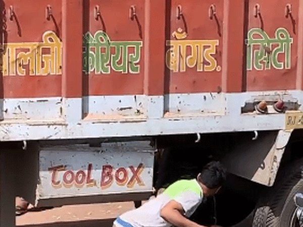 scooty under truck video