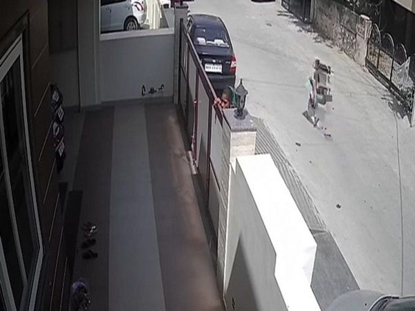 Women throwing plastic bags in houses after spitting