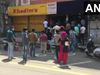 Assam: People line up outside a liquor shop in Dibrugarh 