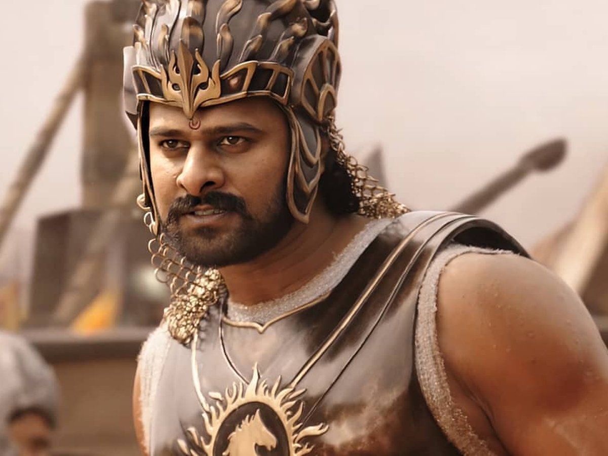 Download Prabhas Hd Baahubali In The Crowd Scene Wallpaper | Wallpapers.com