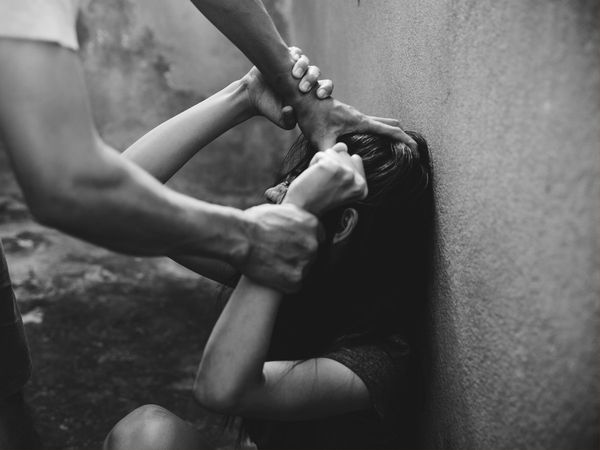 Woman dragged on the ground by holding her hair