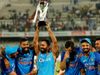 Dinesh Karthik lifts the trophy