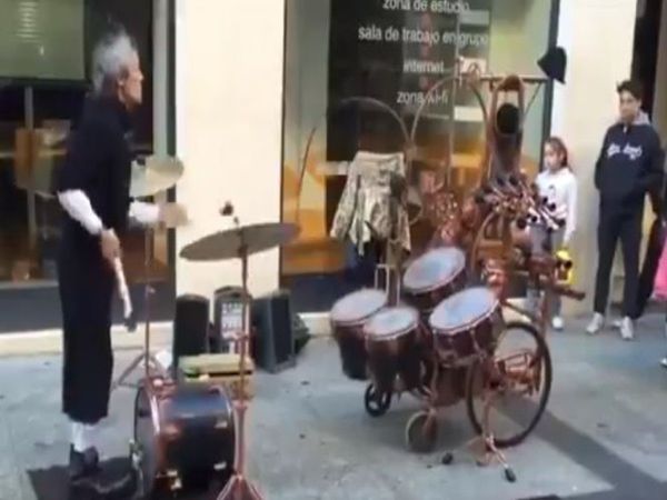 old man playing with drum in unique style video goes viral on social media