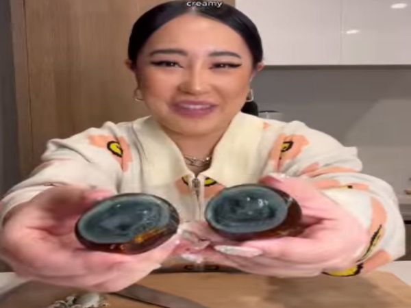 Woman Taste 100 years old Egg Shocking Video Goes Viral