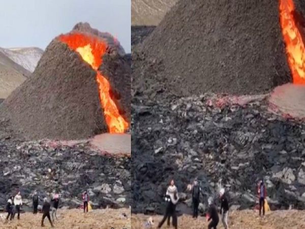 Video People play volleyball next to an erupting volcano in Iceland 