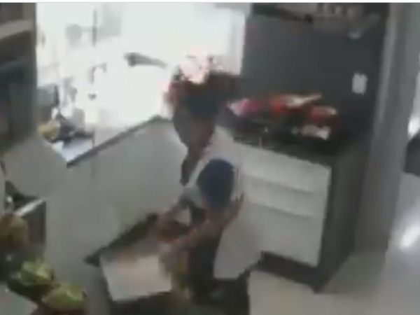 Fire Video Woman hair catches fire while working in kitchen viral video in hindi