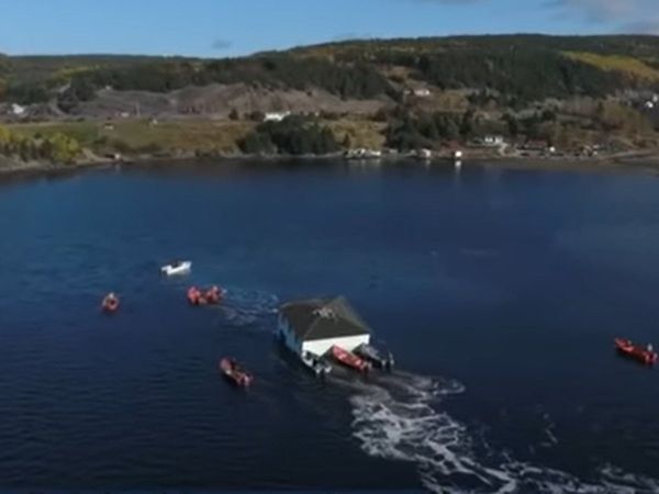 Two-storey house was floated in water with the help of boats and taken to new place, video goes viral