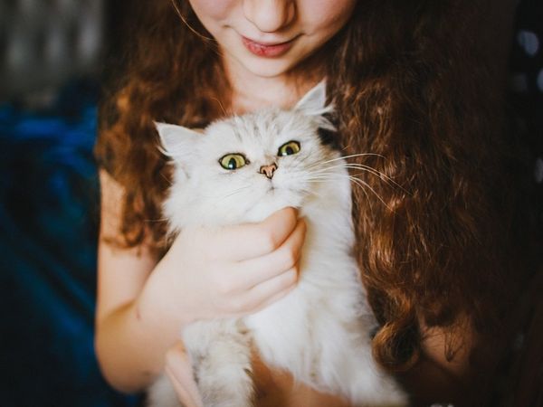 girl with pet cat