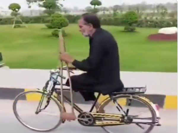 handicap old man was riding bicycle with the help of crutches Heart Touching Video Goes Viral