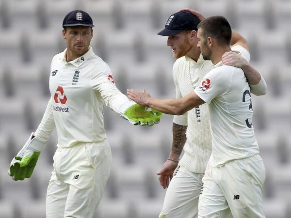 jos buttler with ben stokes and mark wood