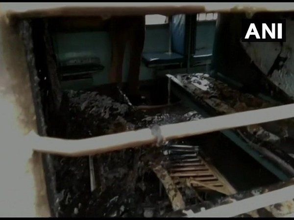 man set train coach on fire
