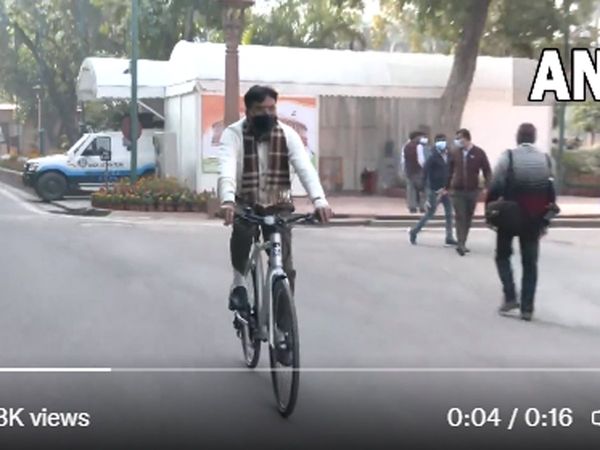 Union Health Minister Mansukh Mandaviya rides a bicycle to Parliament in New Delhi