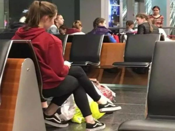 three legs of a girl sitting at the airport know about Optical Illusion Photo Truth