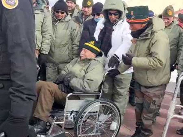 rajnath singh escorts Brigadier(Retd) R V Jatar on wheelchair in Leh
