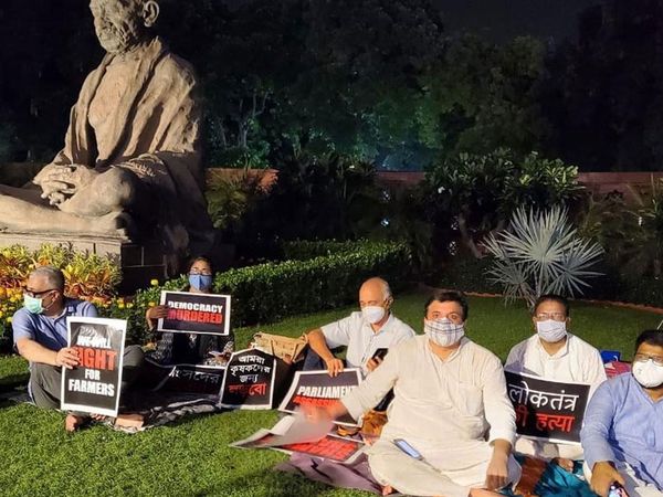 Opposition's suspended MPs in Parliament precincts with pillow and cover singing song