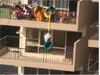 Mother dangles child from 9th to 8th floor with a bedsheet to fetch fallen garment Watch Shocking Video