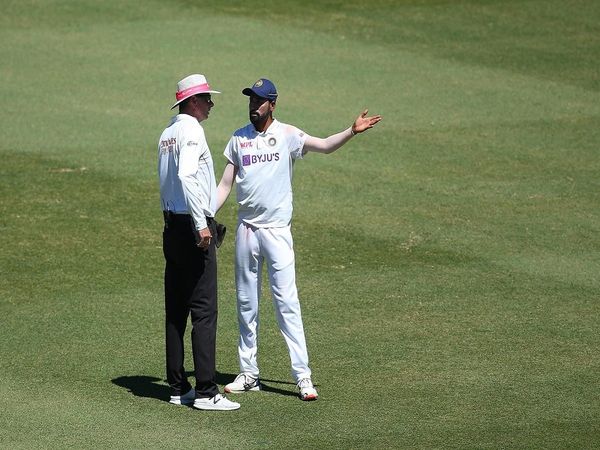 Mohd Siraj with Umpire