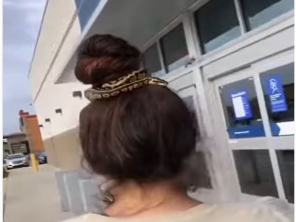 Snake video Woman tied snake in hair bun watch shocking video