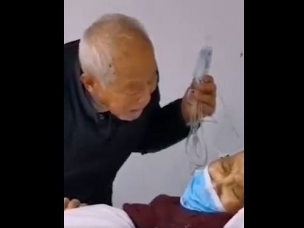 coronavirus husband taking care of wife in hospital china video goes viral