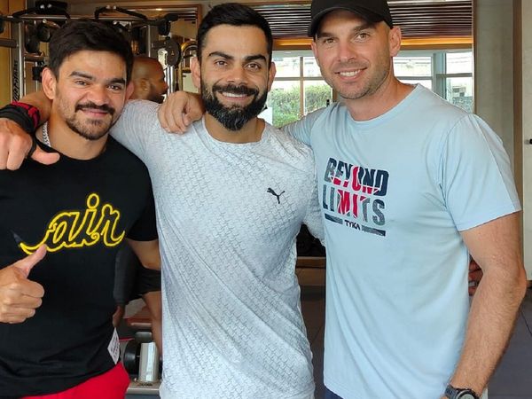 Virat Kohli with Soham Desai and Nick Webb