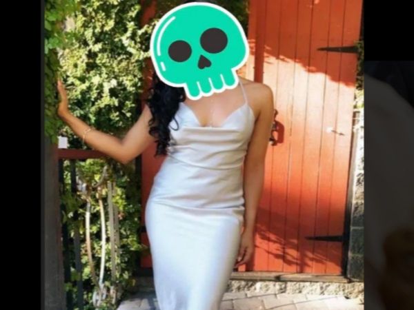  Wedding guest gets mistaken for the Bride after wearing a slinky silk white gown to her big day