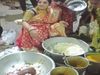 woman distributes leftover food from brothers wedding Heart Touching Photo Goes Viral