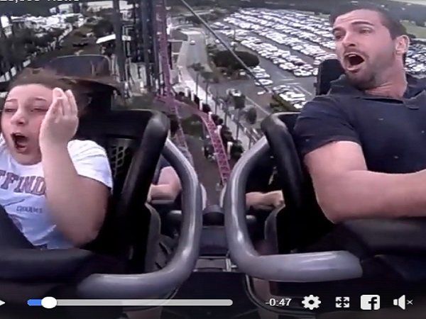  girl rides on roller coaster 